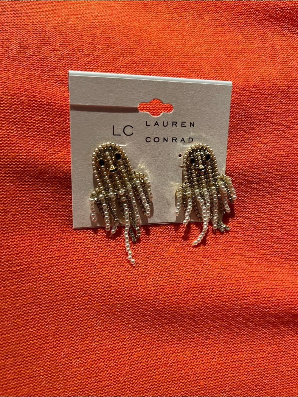 LC Lauren Conrad white and gold colored Ghost dangle Earrings